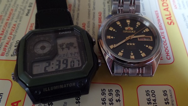 Casio AE1200 and Orient Three Star wristwatches